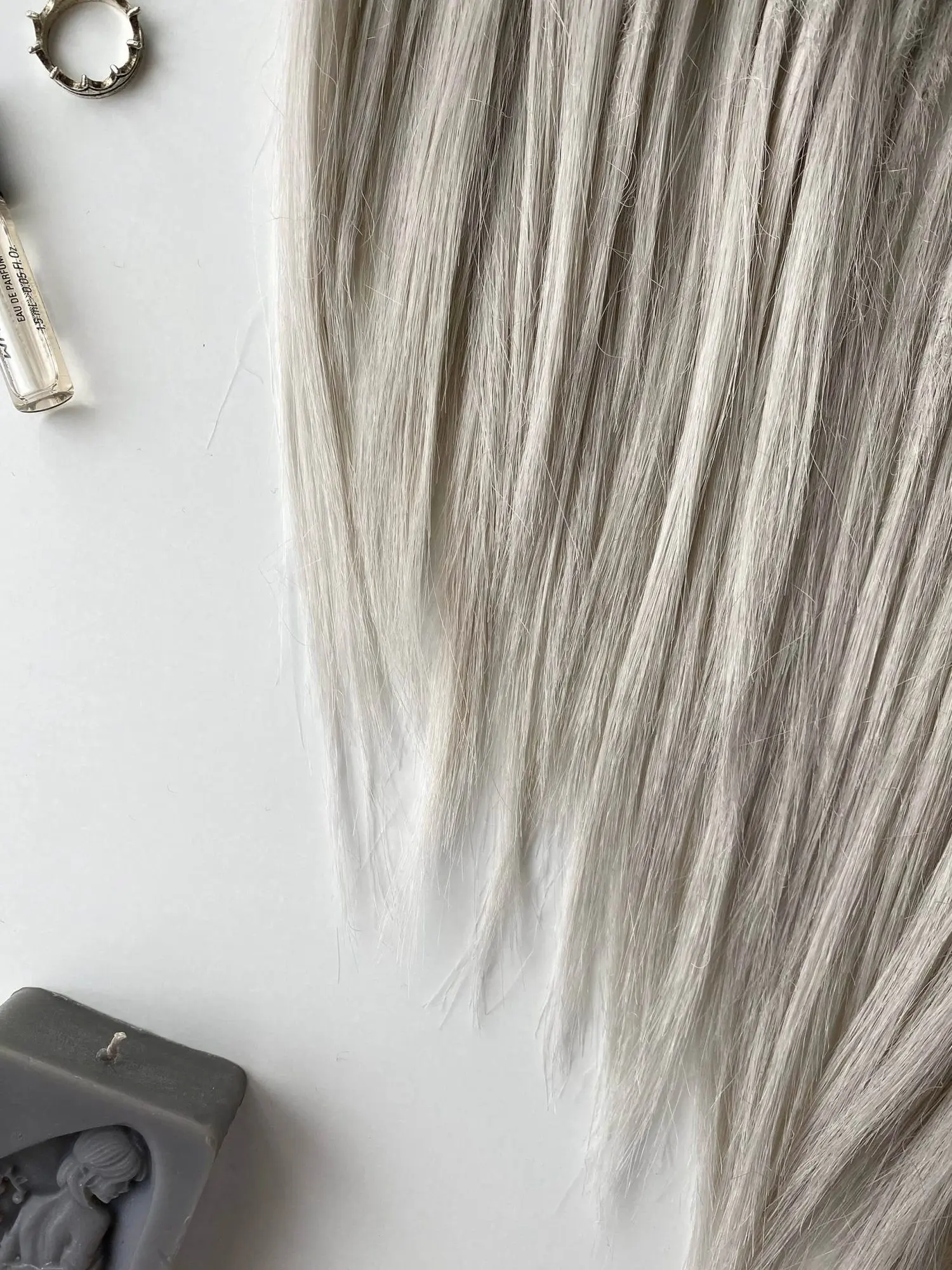 Viking ash blonde smooth dreads platinum tips close-up with silver thorn ring