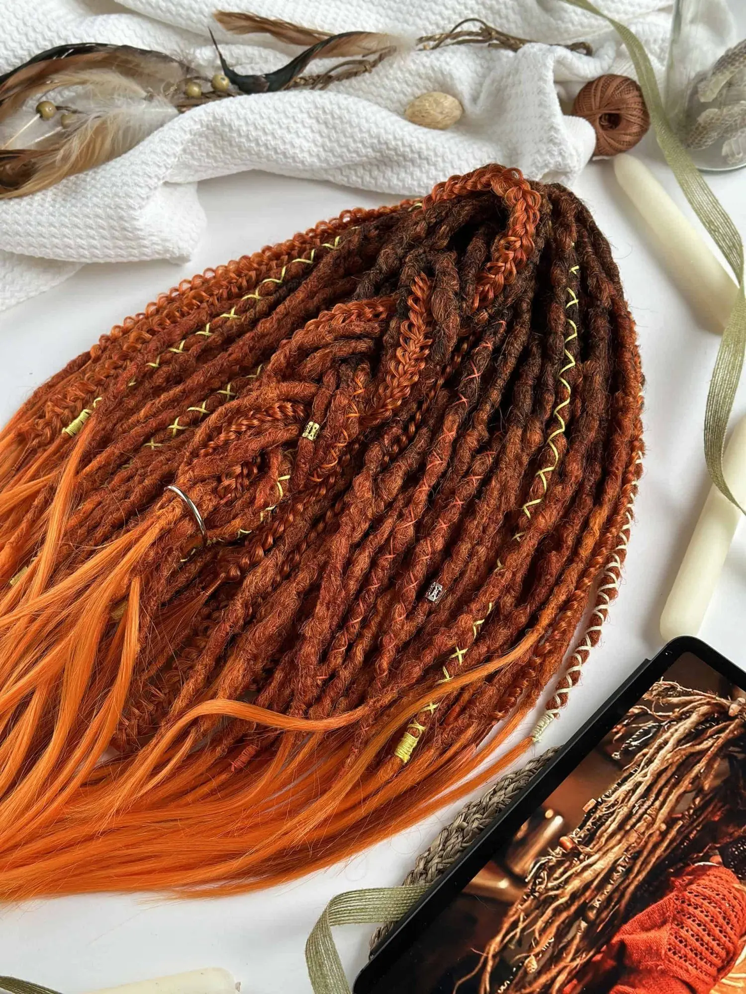 Boho textured dread extensions ginger copper flatlay with natural props