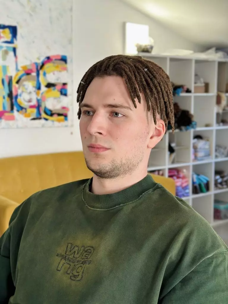 Short natural dreadlocks made from the client’s own hair, front view
